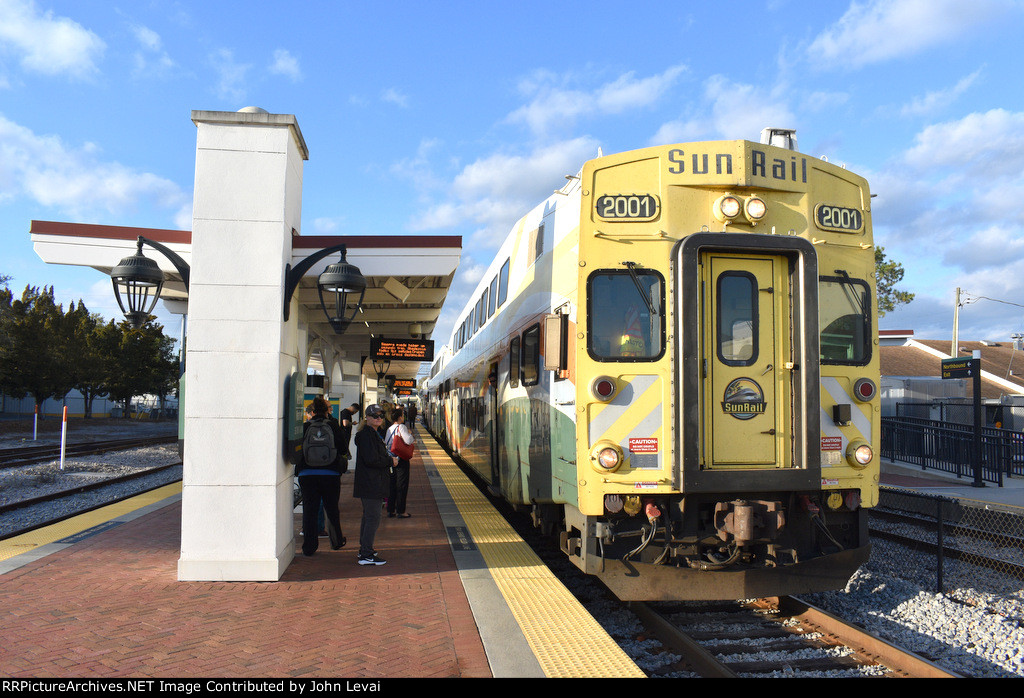 Sunrail Train # P331 about to pause at the Orlando Health / Amtrak Station heading southbound 